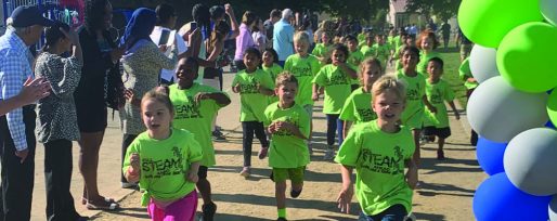 Students running through finish line of jog-a-thon