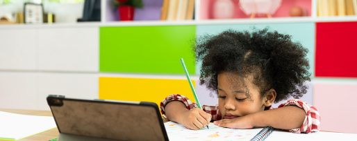 Young African American kid girl studying using digital tablet, preschool child study at home school. Children education, self isolation, coronavirus outbreak social distancing or homeschooling concept