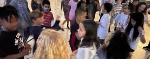 Students gathered in circle at school dance