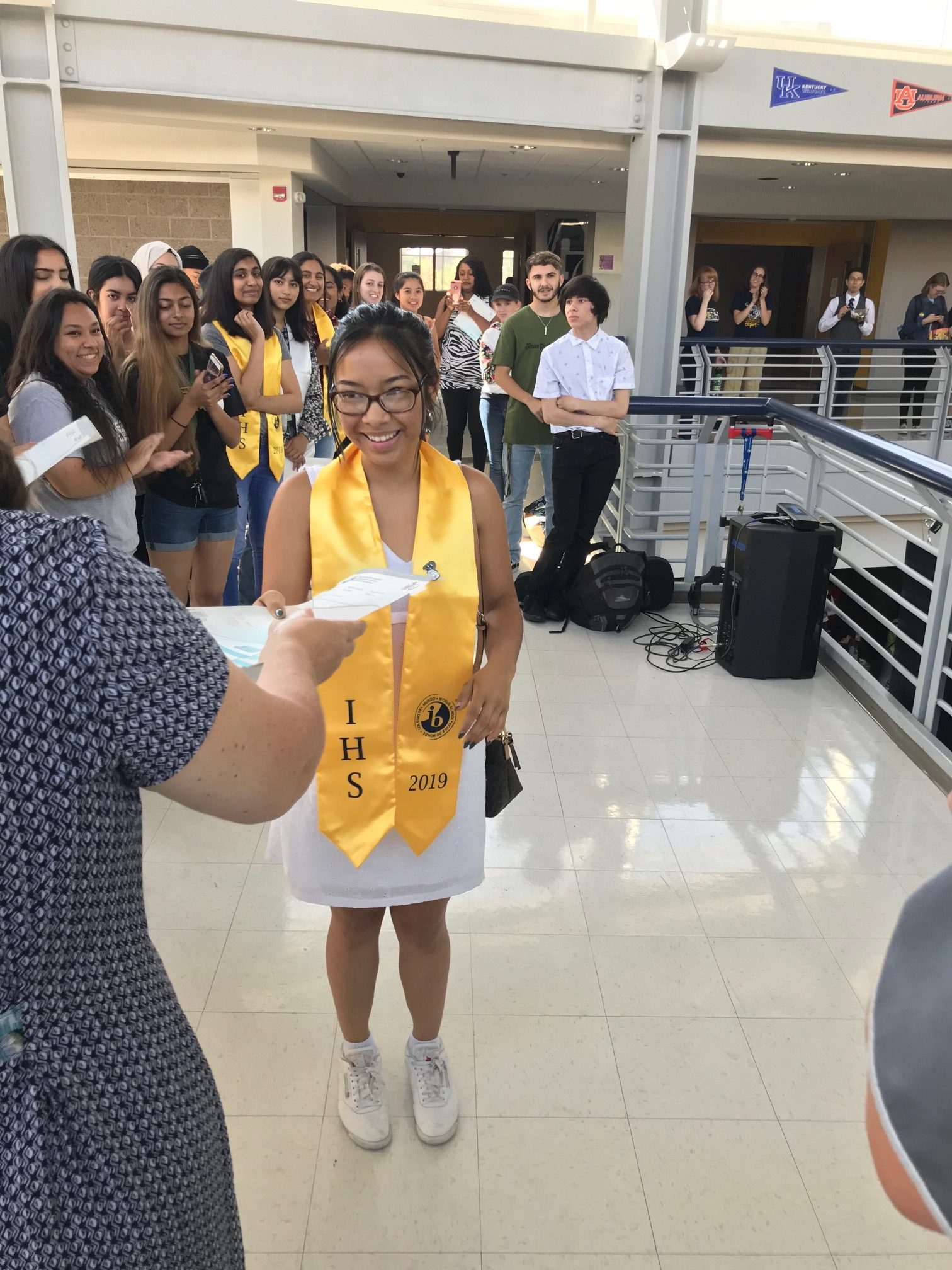 student accepting IB diploma