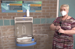 Mrs. Huff near the new water station at Bannon Creek School