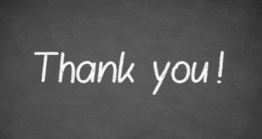 Thank you - made with white chalk on a blackboard