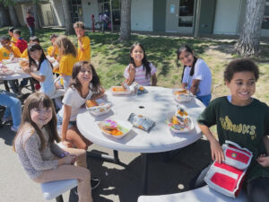 Group of WRE students eating lunch at table