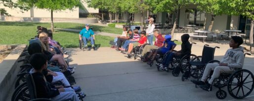 Students in wheelchairs at A Touch of Understanding assembly